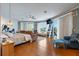 Bright main bedroom boasts water views, access to balcony, and exercise equipment at 830 Pinellas Bayway S, St Petersburg, FL 33715