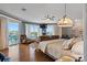 Spacious main bedroom with waterfront views, private balcony, and comfortable lounge area at 830 Pinellas Bayway S, St Petersburg, FL 33715
