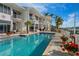 A spacious outdoor pool in front of an upscale condo/townhome complex with a boat dock at 830 Pinellas Bayway S, St Petersburg, FL 33715