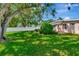 Spacious backyard featuring a well-maintained lawn and secure white privacy fence at 940 43Rd Ne Ave, St Petersburg, FL 33703