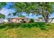 Spacious backyard featuring a well-maintained lawn and patio, perfect for outdoor entertaining and relaxation by the home at 940 43Rd Ne Ave, St Petersburg, FL 33703