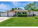 Charming single-story home with well-maintained lawn, lush landscaping, and inviting curb appeal at 940 43Rd Ne Ave, St Petersburg, FL 33703