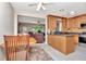 Bright kitchen with light-colored cabinetry, tile backsplash and tile floor that flows into the dining area at 940 43Rd Ne Ave, St Petersburg, FL 33703