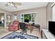 Inviting living room featuring tile floors, a comfortable armchair, and a window with a scenic view at 940 43Rd Ne Ave, St Petersburg, FL 33703
