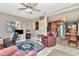 Cozy living room features comfortable seating, a work space, and access to the dining room at 940 43Rd Ne Ave, St Petersburg, FL 33703