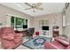 Cozy living room features comfortable seating, a work space, and lots of natural light at 940 43Rd Ne Ave, St Petersburg, FL 33703