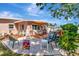 Backyard patio with ample seating, complemented by lush landscaping and a cozy wooden deck area, perfect for relaxation at 940 43Rd Ne Ave, St Petersburg, FL 33703
