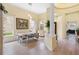 Bright dining room featuring light wood floors and elegant decor at 9897 Sago Point Dr, Seminole, FL 33777
