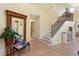 Entryway with staircase, wood floors, and classic decor at 9897 Sago Point Dr, Seminole, FL 33777