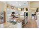 Spacious kitchen with a large island, stainless steel appliances, and natural light at 9897 Sago Point Dr, Seminole, FL 33777