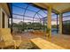 Spacious covered and screened-in lanai offering scenic water views and relaxing outdoor living space at 9897 Sago Point Dr, Seminole, FL 33777