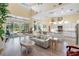 Open concept living room with high ceilings and a view of the backyard at 9897 Sago Point Dr, Seminole, FL 33777