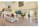 Bright and airy living room with a staircase and open floor plan at 9897 Sago Point Dr, Seminole, FL 33777