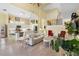 Spacious living room with kitchen and staircase in the background at 9897 Sago Point Dr, Seminole, FL 33777
