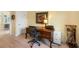 Home office setup featuring a wooden desk, a rolling chair, and wood-look floors at 9897 Sago Point Dr, Seminole, FL 33777