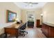 A cozy office space featuring hard floors, natural lighting, and traditional decor at 9897 Sago Point Dr, Seminole, FL 33777