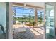 Spacious screened patio with ceiling fan and serene lake views at 9897 Sago Point Dr, Seminole, FL 33777