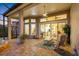 Outdoor patio space with brick flooring, a ceiling fan, and furniture, perfect for entertaining at 9897 Sago Point Dr, Seminole, FL 33777