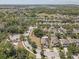 Aerial view of a charming neighborhood, highlighting the manicured lawns and tree coverage at 10524 White Peacock Pl, Riverview, FL 33578