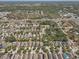 Aerial view of a residential neighborhood with lush greenery and easy highway access at 10524 White Peacock Pl, Riverview, FL 33578