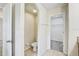 Bright bathroom featuring a toilet and access to a walk-in closet at 10524 White Peacock Pl, Riverview, FL 33578