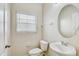 Bathroom features neutral paint, bright lighting, toilet and sink at 10524 White Peacock Pl, Riverview, FL 33578