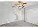 Bedroom with carpet flooring, closet, and entry doorway at 10524 White Peacock Pl, Riverview, FL 33578