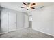 Bedroom with carpet flooring, ceiling fan, and entry doorway at 10524 White Peacock Pl, Riverview, FL 33578