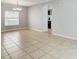 Spacious dining area with tile flooring, ample natural light, and seamless access to the kitchen at 10524 White Peacock Pl, Riverview, FL 33578