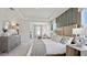 Large main bedroom with neutral décor, carpeted floors and a view into the sitting room at 10589 Farm Hill Ave, Land O Lakes, FL 34638