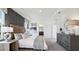 Main bedroom featuring a large bed, grey dresser and ensuite bathroom at 10589 Farm Hill Ave, Land O Lakes, FL 34638