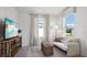 Inviting sitting room provides a comfortable area, perfect for relaxing and entertainment at 10589 Farm Hill Ave, Land O Lakes, FL 34638