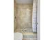 Walk-in shower featuring stone flooring and marble tile walls at 107 Parkside Colony Dr, Tarpon Springs, FL 34689