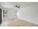 Bedroom featuring wood floors, neutral walls, a ceiling fan, and windows offering plenty of natural light at 107 Parkside Colony Dr, Tarpon Springs, FL 34689
