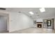 Spacious living room with fireplace, skylights, ceiling fan and sliding glass doors to the lanai at 107 Parkside Colony Dr, Tarpon Springs, FL 34689