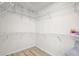 Large walk-in closet with built-in shelving and ample storage space at 107 Parkside Colony Dr, Tarpon Springs, FL 34689