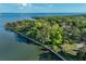 Aerial view of a park with trees along the waterfront with walking path at 109 Wateredge Ct, Safety Harbor, FL 34695