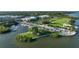 Aerial view of the waterfront area featuring a marina, park, and various buildings at 109 Wateredge Ct, Safety Harbor, FL 34695