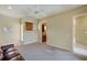 Bonus room with a leather couch, a ceiling fan and doorways to additional rooms at 109 Wateredge Ct, Safety Harbor, FL 34695