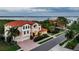 Stunning Mediterranean home with tile roof, manicured landscaping, and picturesque water views from multiple levels at 109 Wateredge Ct, Safety Harbor, FL 34695