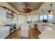 Gourmet kitchen features stainless steel appliances, quartz countertops, and a stylish center island at 109 Wateredge Ct, Safety Harbor, FL 34695