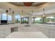Bright, open kitchen offers counter seating, ample storage, and scenic views from large windows at 109 Wateredge Ct, Safety Harbor, FL 34695