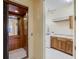 Convenient laundry room with washer, dryer, sink, and ample cabinet space, adjacent to elevator at 109 Wateredge Ct, Safety Harbor, FL 34695