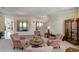 Inviting living room with comfortable seating, elegant decor, and scenic views from the large windows at 109 Wateredge Ct, Safety Harbor, FL 34695