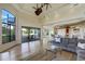 Open-concept living area with hardwood flooring, comfortable seating, and seamless flow to the kitchen at 109 Wateredge Ct, Safety Harbor, FL 34695