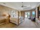 Serene primary bedroom featuring a sitting area, access to a private balcony, and decorative details at 109 Wateredge Ct, Safety Harbor, FL 34695