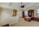 Spacious office with custom built-in cabinetry, arched windows, and a unique ceiling fan at 109 Wateredge Ct, Safety Harbor, FL 34695