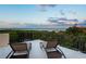 Relaxing rooftop deck with lounge chairs and sweeping views of the Intracoastal Waterway at 109 Wateredge Ct, Safety Harbor, FL 34695