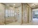 Corner shower with glass enclosure and tiled walls, offering a modern and elegant design at 109 Wateredge Ct, Safety Harbor, FL 34695