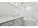 Stylish bathroom features a gray vanity, white subway tile, and modern fixtures at 11022 Moonsail Dr, Parrish, FL 34219
